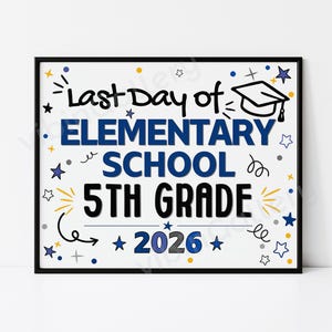 May include: A framed sign with the text "Last Day of Elementary School 5th Grade 2026" in blue and black. The sign is decorated with stars, a graduation cap, and other celebratory elements. The frame is black.
