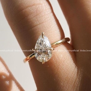 Pear Cut Moissanite Engagement Ring: 14K Yellow Gold Solitaire