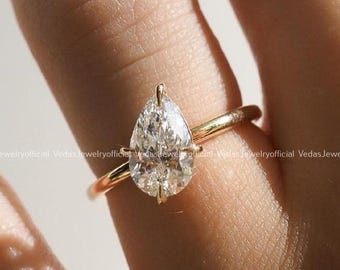 Pear Cut Moissanite Engagement Ring: 14K Yellow Gold Solitaire