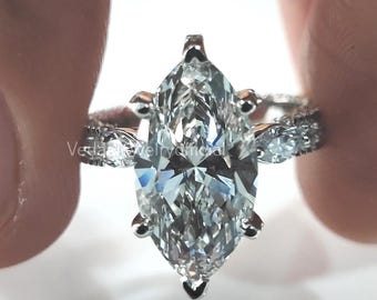 3.01 carat E Color VS1 Clarity IGI Certified Marquise Cut / Lab Grown Diamond Cathedral Engagement Ring with side diamonds and hidden halo