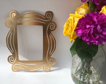 Marco de fotos con mirilla de Friends, decoración de cartulina dorada (19 x 24 cm)