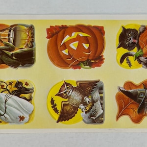 May include: A sheet of vintage Halloween stickers featuring a witch, an owl, a black cat, and jack-o'-lanterns. The stickers are printed on a yellow background with a white border. The text "Eureka Specialty Printing Company 1961" is printed in the bottom left corner.