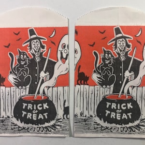 May include: Two vintage Halloween treat bags with a black and white illustration of a witch stirring a cauldron with a black cat and a ghost. The text on the bags reads "Trick or Treat".