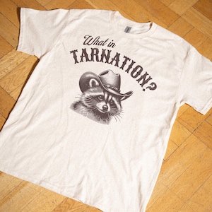 What In Tarnation Raccoon Cowboy T Shirt, Retro Country Western Raccoon Meme Vintage Graphic Funny Unisex Trendy Women&#39;s Vintage Tee