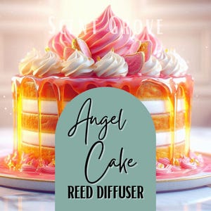 May include: A layered cake-shaped reed diffuser with a pink and white frosting design. The cake has a caramel-colored glaze dripping down the sides. The text "Angel Cake" and "Reed Diffuser" are displayed on the front.