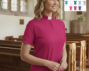 May include: A short-sleeved magenta clergy shirt featuring a standing collar with a white tab insert and a button-down placket. The shirt is displayed alongside a color chart showing various available shades including mint, black, charcoal, purple, lime, pink, navy, white, turquoise, light blue, heather, raspberry, red, and royal.