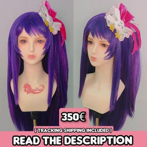 May include: A purple wig with long, straight hair, styled on a mannequin head. The wig features a pink and white hair accessory with a bunny and stars. The text "READ THE DESCRIPTION" is displayed at the bottom.