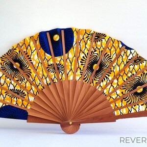 Colorful hand-crafted hand fan made of wood and African wax print fabric in yellow tones – a unique work of art for every occasion! image 7