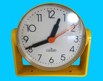 German Designclassic 1970s THE HOUSE CLOCK Cult Clock Table Clock Kitchen Clock Rotating in the Stand Wall Clock Yellow Quartz 20 cm Germany E0