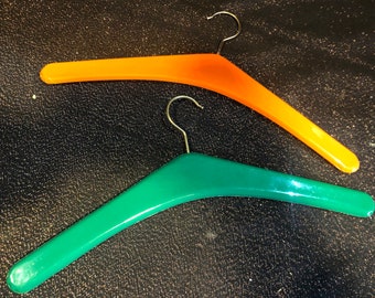 1970s 2 iconic hangers orange/ red wood covered with plastic like new