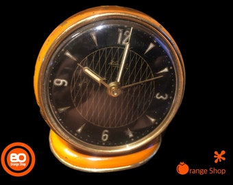 1950 Kienzle alarm clock mechanically fully functional very stylish in orange on pedestal Germany