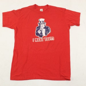 May include: Red t-shirt with a graphic of Uncle Sam pointing and the text "I WANT YOURS".