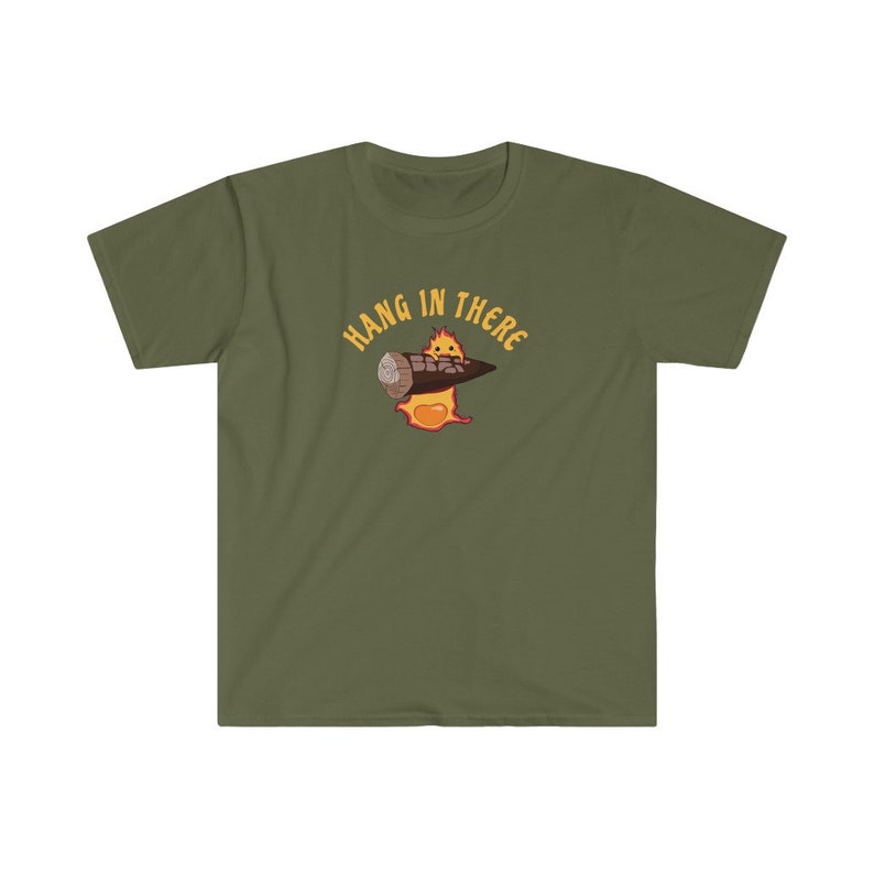 May include: A green t-shirt with a cartoon character holding a log and the text "Hang in there" in yellow.