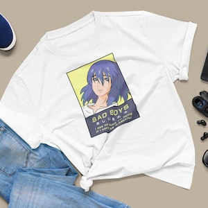 May include: White t-shirt with a graphic of a blue-haired anime character with the text "SAD BOYS 悲しい男の I see no point in living if I can't be beautiful"