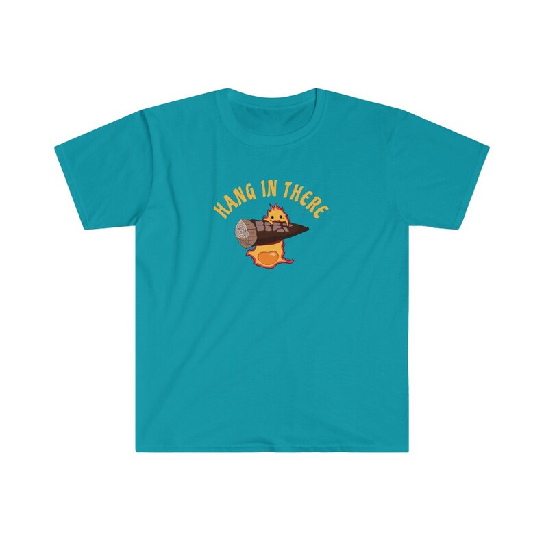 May include: A turquoise blue t-shirt with a cartoon character holding a log and the text "Hang in there" in yellow.