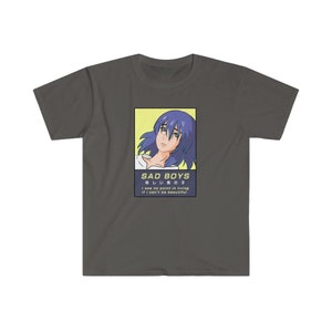 May include: A dark gray t-shirt with a graphic of an anime character with blue hair. The graphic is in a yellow and blue frame with the text "SAD BOYS 悲しい男の子 I see no point in living If I can't be beautiful".