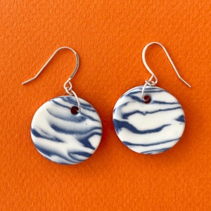 porcelain and sterling silver round dangle earrings minimalist simple contemporary modern handmade delft blue white nerikomi