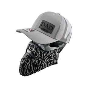 May include: A gray and white trucker hat with a black patch that says "DAD EST. 2024".