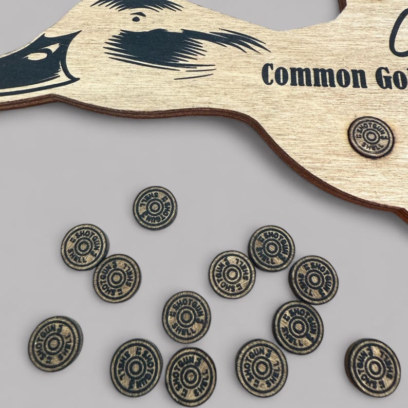 Showing a close up of the engraved wood shot shell markers that are used to mark the ducks that have been harvested in the duck harvest log.