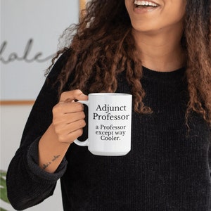 May include: White ceramic mug with black text that reads "Adjunct Professor, a Professor except way Cooler."