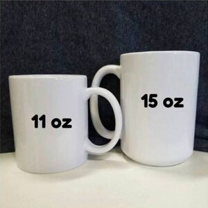 May include: Two white ceramic mugs, one is 11 oz and the other is 15 oz.