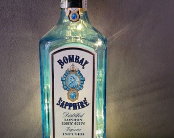 Bombay Sapphire gin bottle.LED warm white fairy lights + spare batteries.  Upcycled repurposed empty cleaned bottle