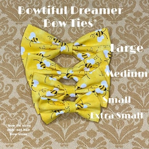 May include: Four yellow bow ties with a bee pattern, labeled 'Large', 'Medium', 'Small', and 'Extra Small'.