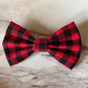 May include: Red and black plaid bow tie.
