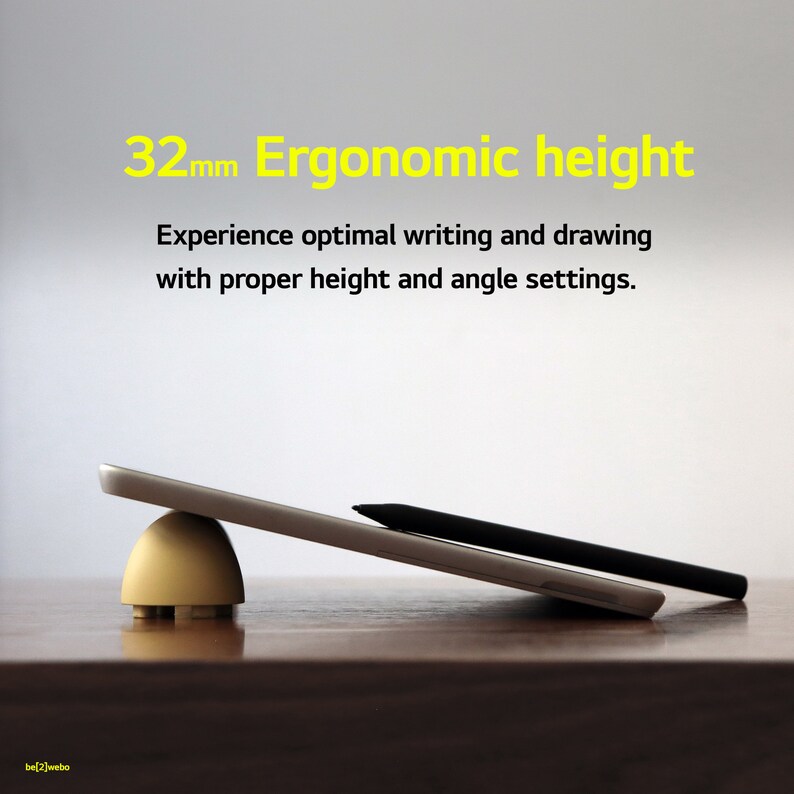 May include: A tablet computer is propped up on a beige stand, creating a 32mm ergonomic height. The text "32mm Ergonomic height" is displayed above the image. The text "Experience optimal writing and drawing with proper height and angle settings." is displayed below the image.
