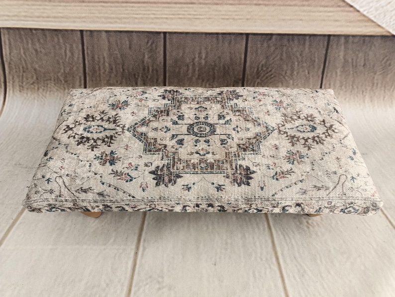 a decorative rug or cushion placed on a wooden surface.