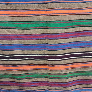 May include: A striped woven rug with alternating bands of brown, orange, green, blue, red, and black.