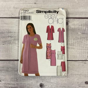 May include: A Simplicity Easy Chic sewing pattern packet. The packet features a woman wearing a pink dress and jacket. The packet includes illustrations of various dress and jacket designs. The text "Simplicity easy CHIC" is visible.