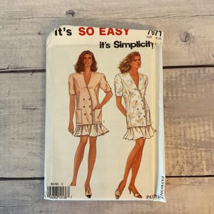 May include: A Simplicity sewing pattern envelope labeled It's SO EASY 7671 for sizes 8-20. The front displays illustrations of two double-breasted jackets with short sleeves, patch pockets, and ruffled hems, one in solid light pink and one in a floral print.