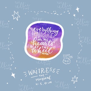 May include: A sticker with a watercolor background in shades of purple, pink, and orange. The sticker features white text that reads "everything changes oh, my heart's at the wheel now". The sticker is 5 inches in diameter and is labeled "Waitress - The Musical".