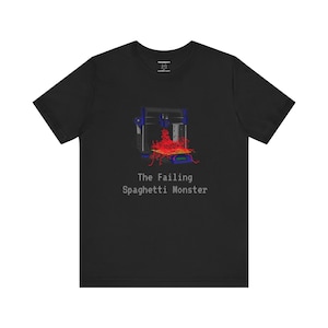 Op de afbeelding: Een zwart T-shirt met een afbeelding van een 3D-printer met rood filament dat eruit stroomt, en de tekst "The Failing Spaghetti Monster".