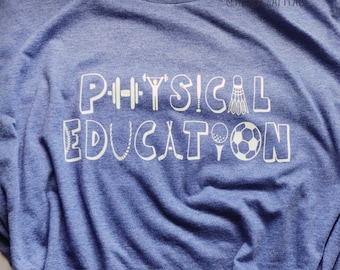 May include: A blue t-shirt with the words "PHYSICAL EDUCATION" in white, with various sports icons incorporated into the letters.