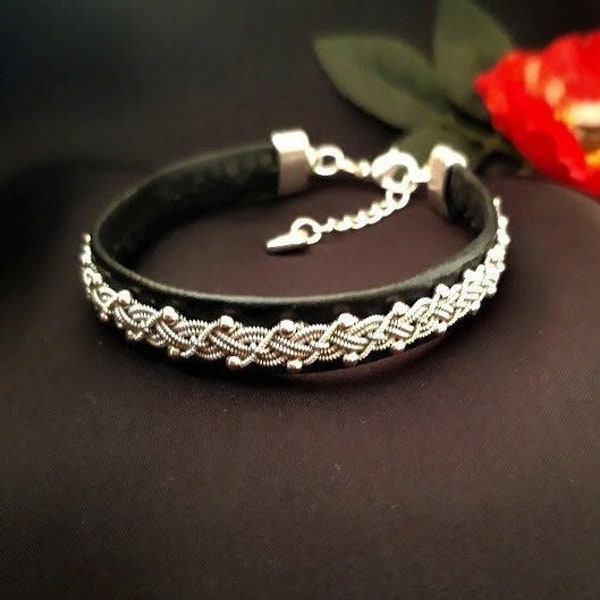 Black sami inspired bracelet in faux leather and tin wire plait with metal beads and small heart pendant