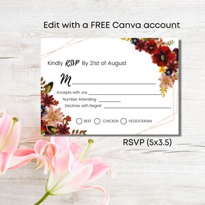 May include: A white RSVP card with a gold geometric frame and floral design. The card has a section for the guest's name, a section for accepting or declining the invitation, and a section for meal choices: beef, chicken, or vegetarian. The text on the card reads "Kindly RSVP by 21st of August".
