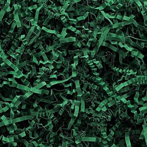May include: Close-up of emerald green crinkle cut paper, a decorative packaging material. The shredded paper is tightly packed, creating a textured, layered effect. Ideal for cushioning and adding a pop of color to gift boxes and product packaging.