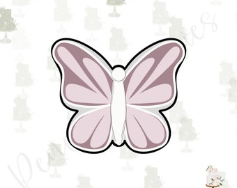 May include: A pink butterfly cookie cutter with a white center. The cutter is made of metal and has a smooth, shiny finish.