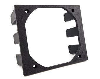 May include: Black plastic fan mount with three slots for screws. The mount has a square shape with rounded corners and a cutout for a fan.