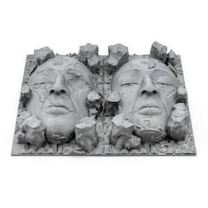 May include: A 3D printed sculpture of two faces, partially obscured by a rough, textured surface. The faces are rendered in a gray color, giving the impression of stone.