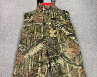 Peto infantil RealTree talla XL (34x28) de lona marrón con estampado de camuflaje, ideal para la caza.