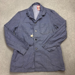 May include: A blue long-sleeved jacket with a collared neckline and a button-down front. The jacket features a single chest pocket on the left side, two lower front pockets, and a small red tag with the text 111 near the collar.