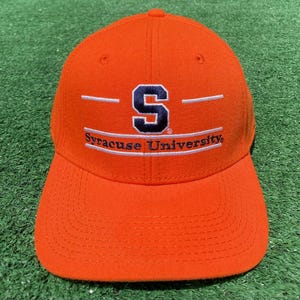 May include: An orange baseball cap with a white and blue embroidered Syracuse University logo. The logo features a large "S" with a white outline and the words "Syracuse University" in white.