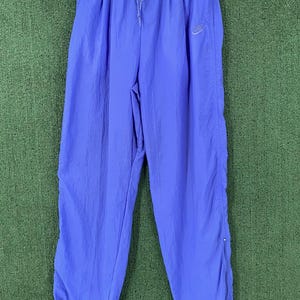 blue nike windbreaker pants