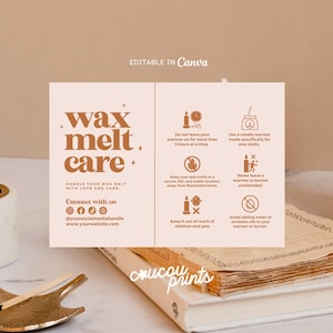 May include: A beige card with brown text reading "wax melt care" and care instructions. The card is on a stack of books with a lit candle and a gold-colored match holder. The text includes safety tips.