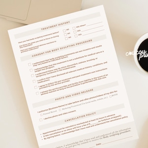 May include: A cream-colored body sculpting consent form with headings like "Treatment History" and "Consent for Body Sculpting Procedure." A cup of coffee and a pen are next to the form. The words "crucou prints" are on the cup.
