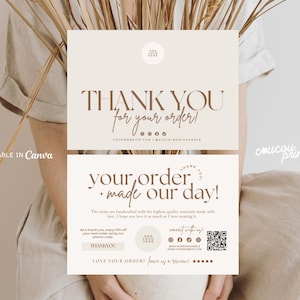 May include: Two beige thank you cards with brown text. The top card reads "THANK YOU for your order!" and the bottom card says "your order + made our day!" with additional text and social media icons. The cards are held by a person.