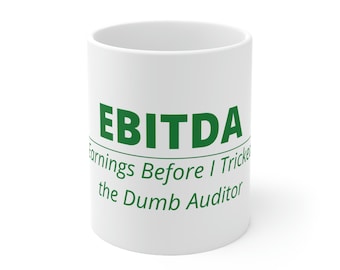 May include: White ceramic coffee mug with the text "EBITDA Earnings Before I Tricked the Dumb Auditor" in green lettering.